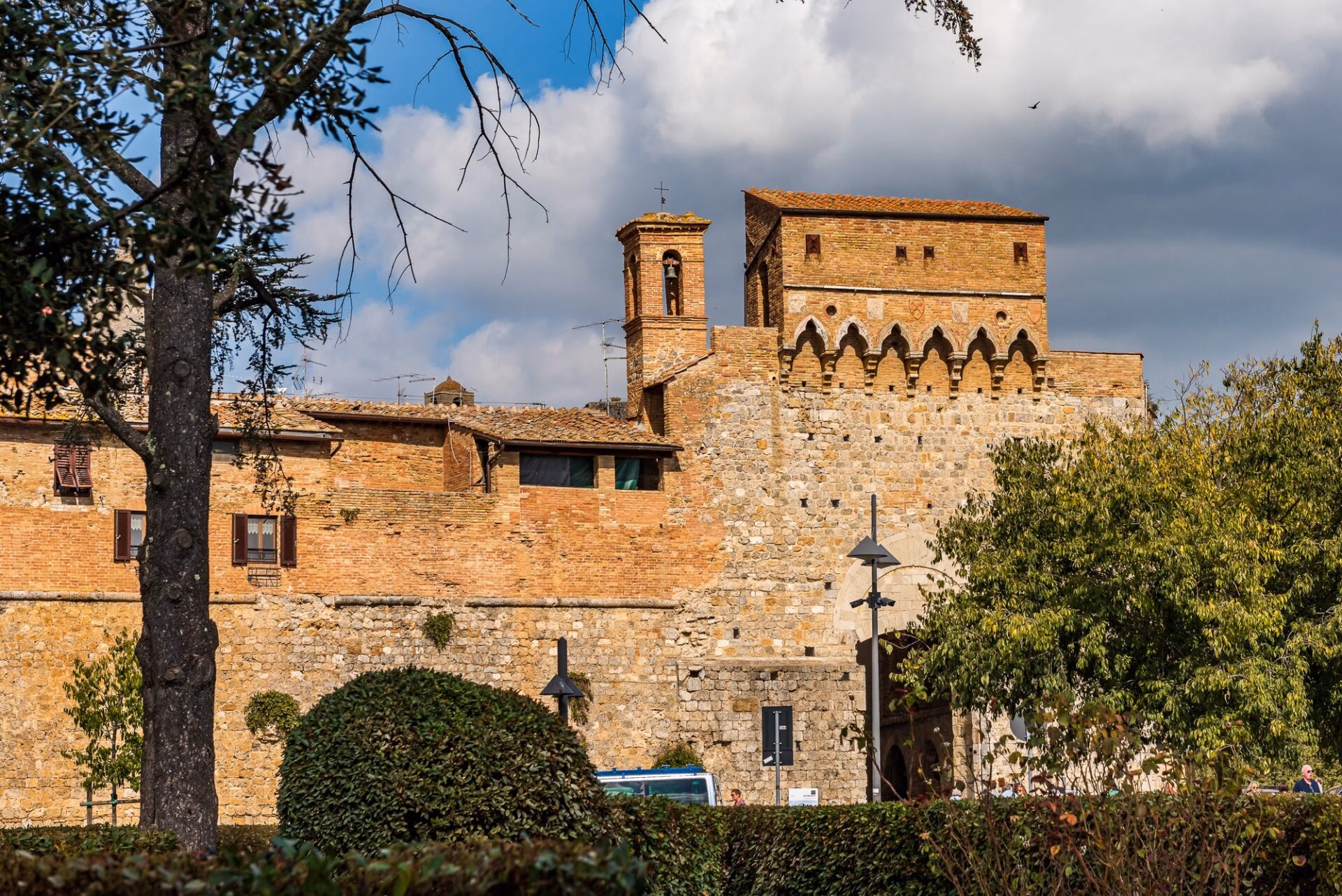 Medieval walls of San Gimignano with a tower seen from outside
