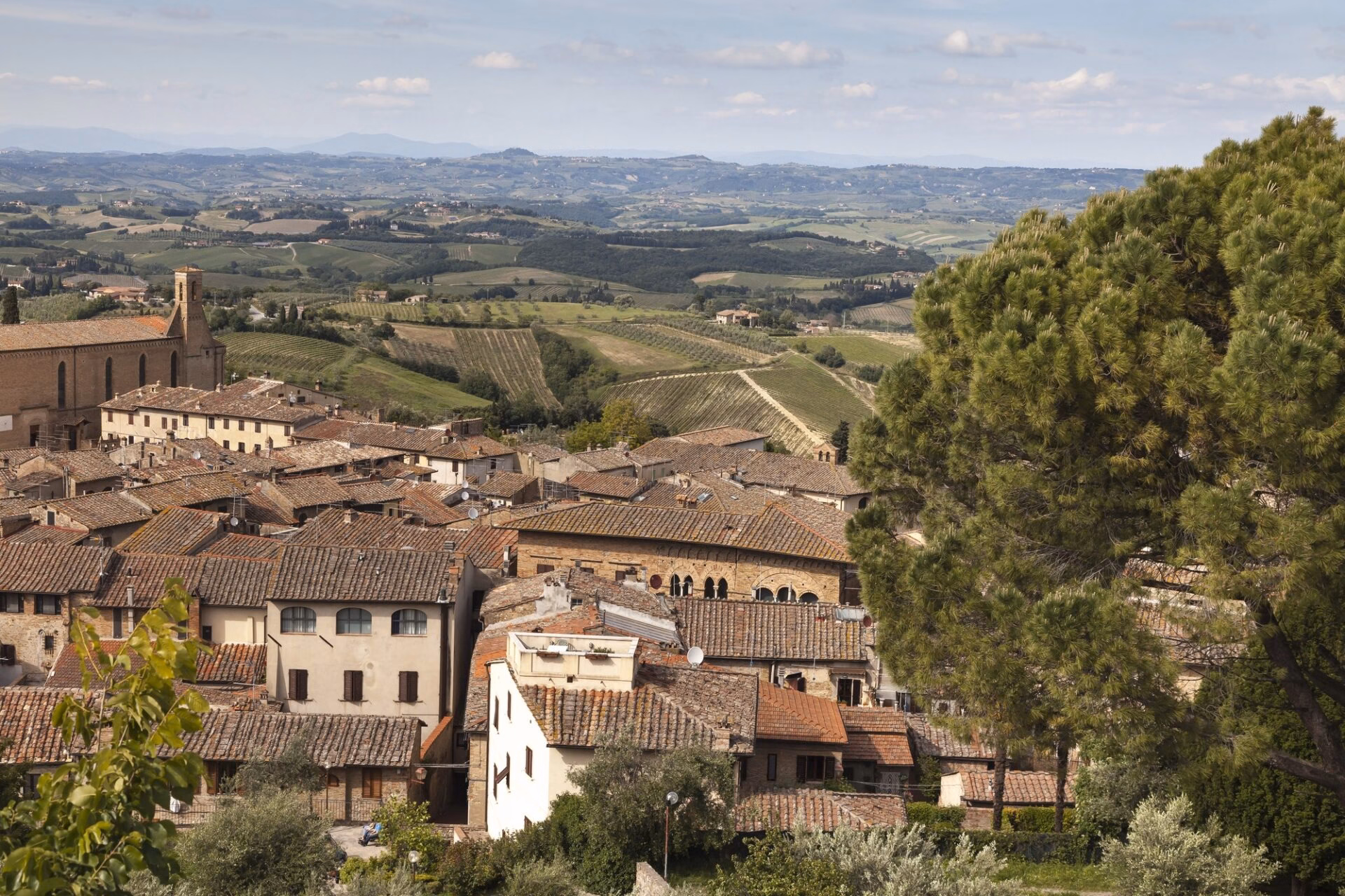 Panoramic view across the rooftops of San Gimignano to the Tuscan countryside