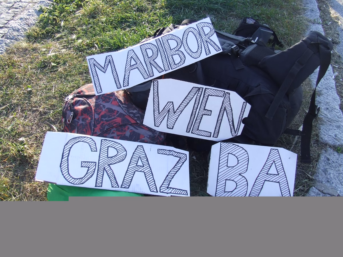 hitchhiking with a sign