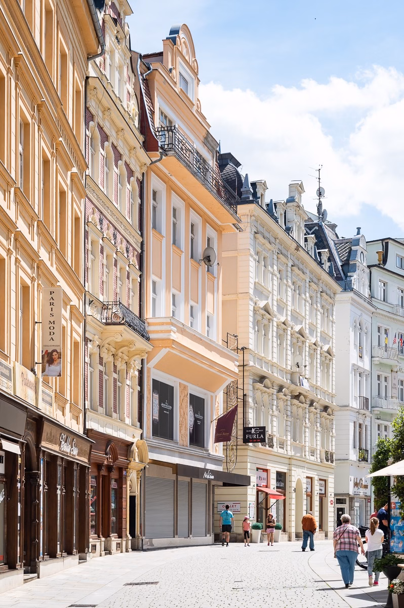 Spa promenade in central Karlovy Vary lined with historic spa houses