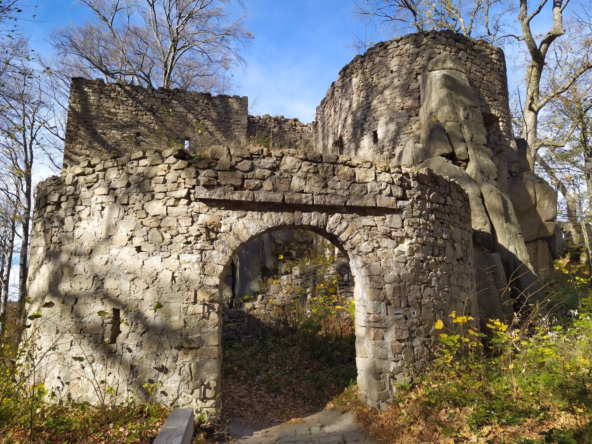 Ruins of medieval Bolczów Castle in the autumn forest of the Rudawy Janowickie