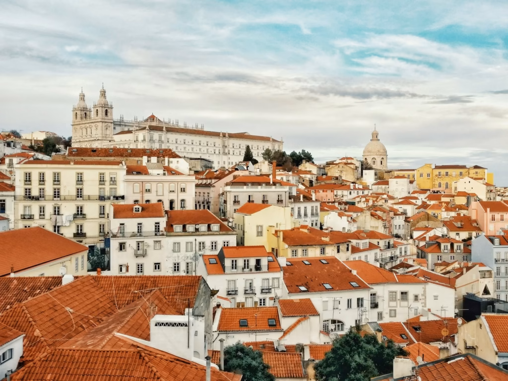 Lisbon, Portugal — view over the city's red rooftops and the Tagus river