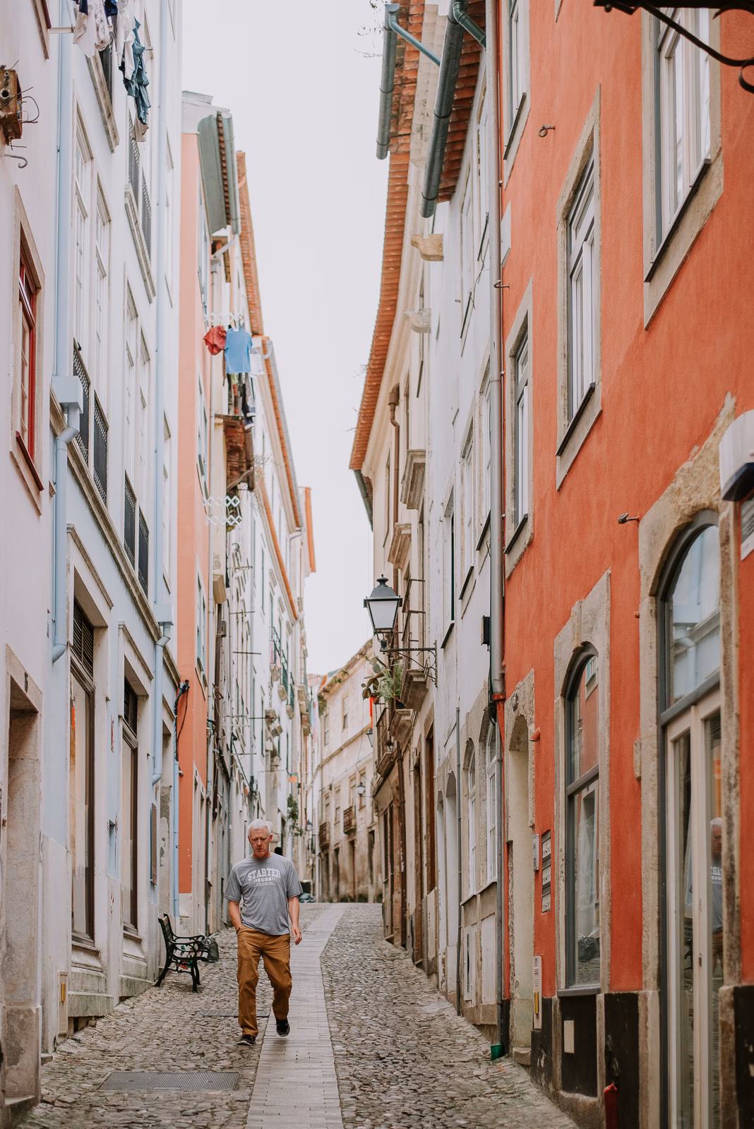 A narrow cobbled street in the historic Alta quarter of Coimbra