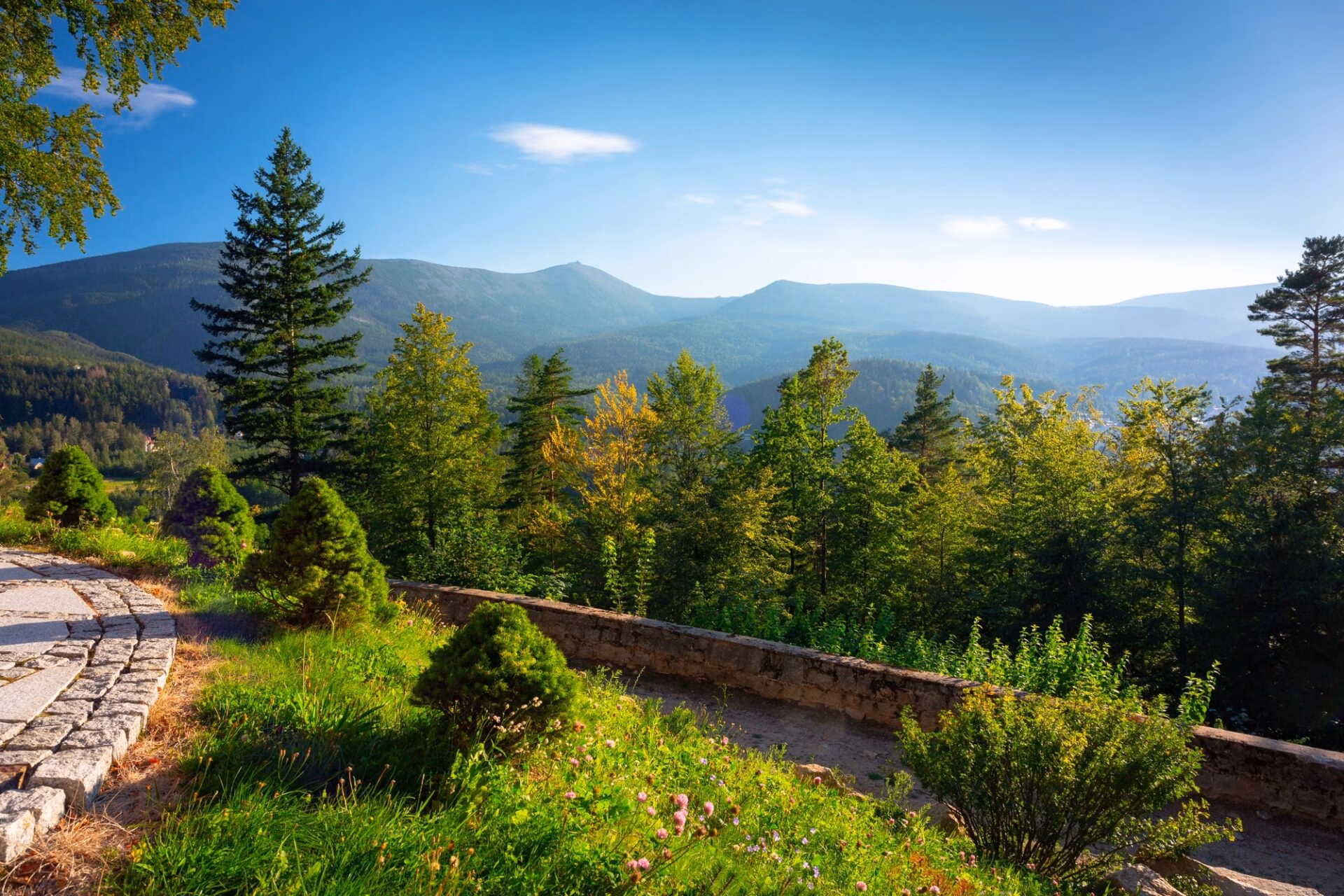 Summer view from a terrace in the Giant Mountains above the forests and ridges near Karpacz