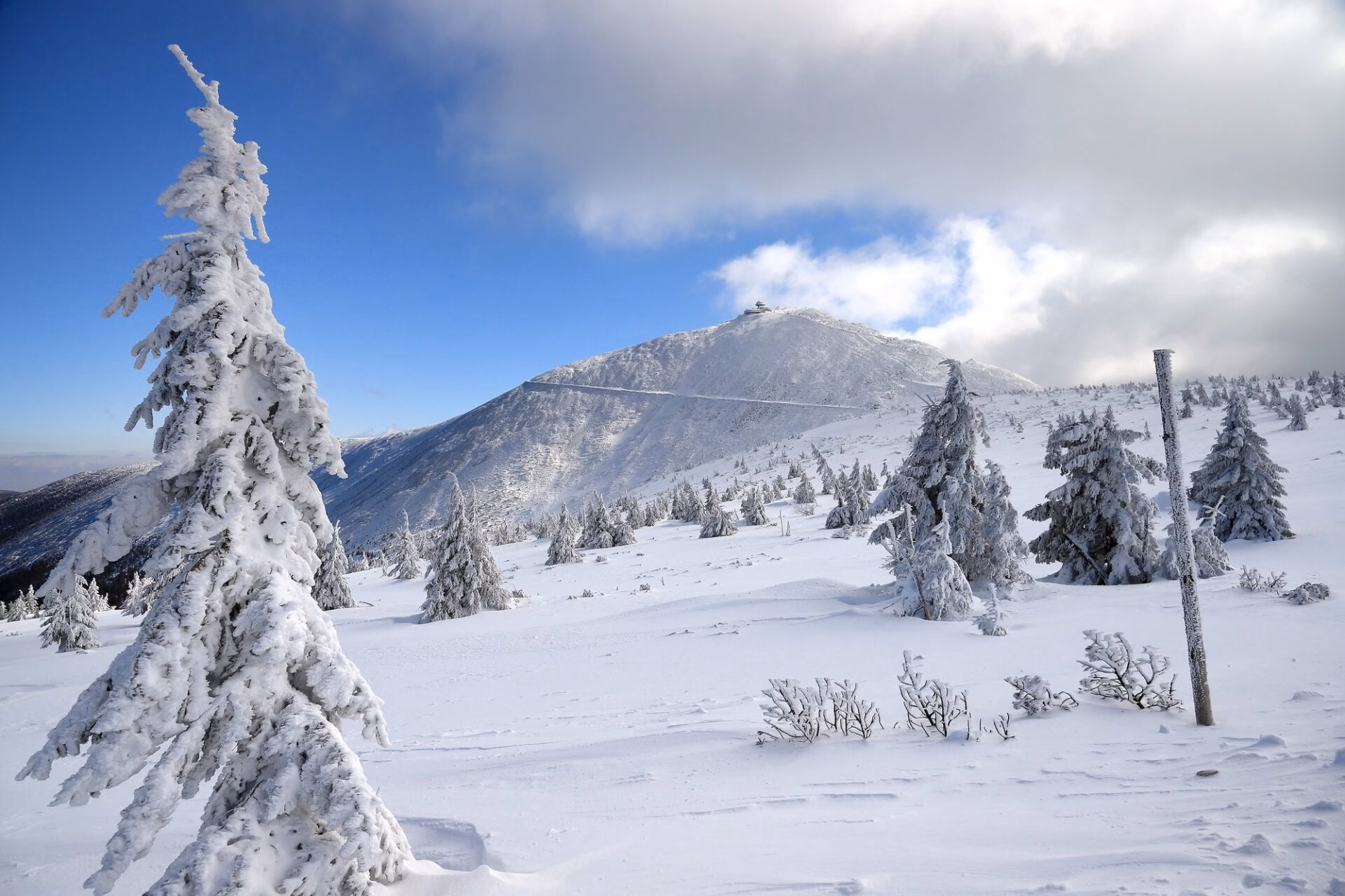 Winter view of Sniezka and the snow-covered Giant Mountains above Karpacz