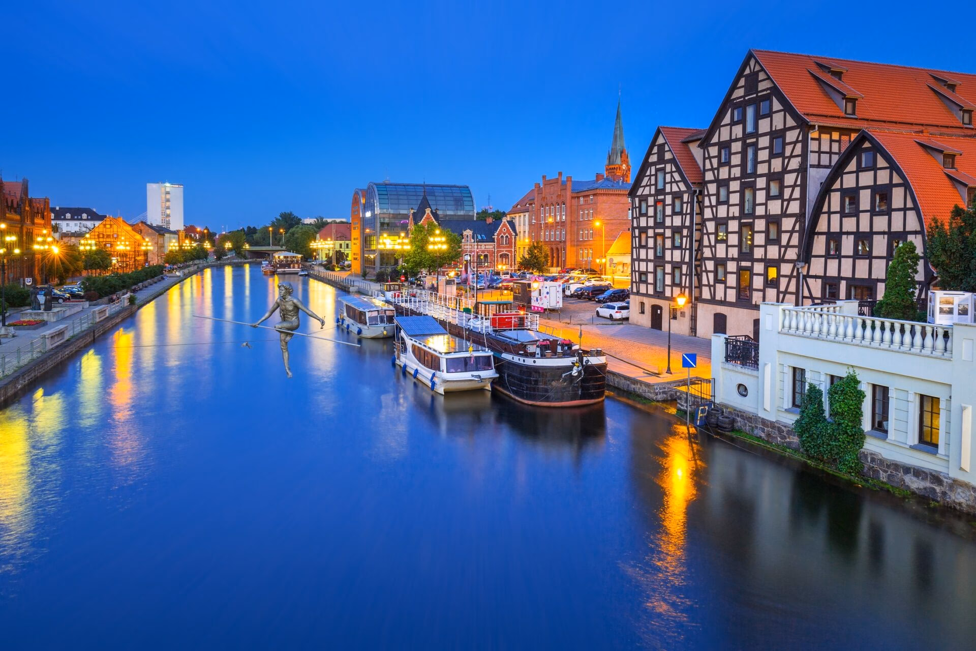Historic granaries on the bank of the Brda river in Bydgoszcz at dusk