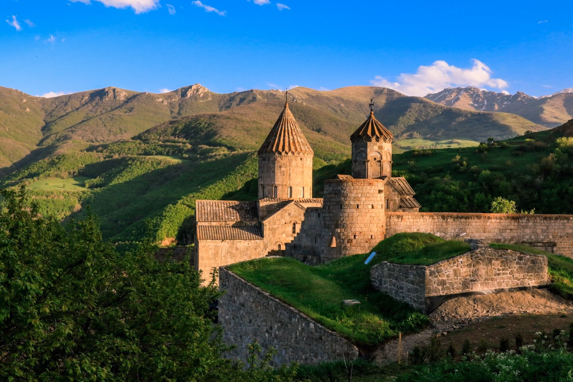 Tatev Monastery surrounded by the green mountains of southern Armenia