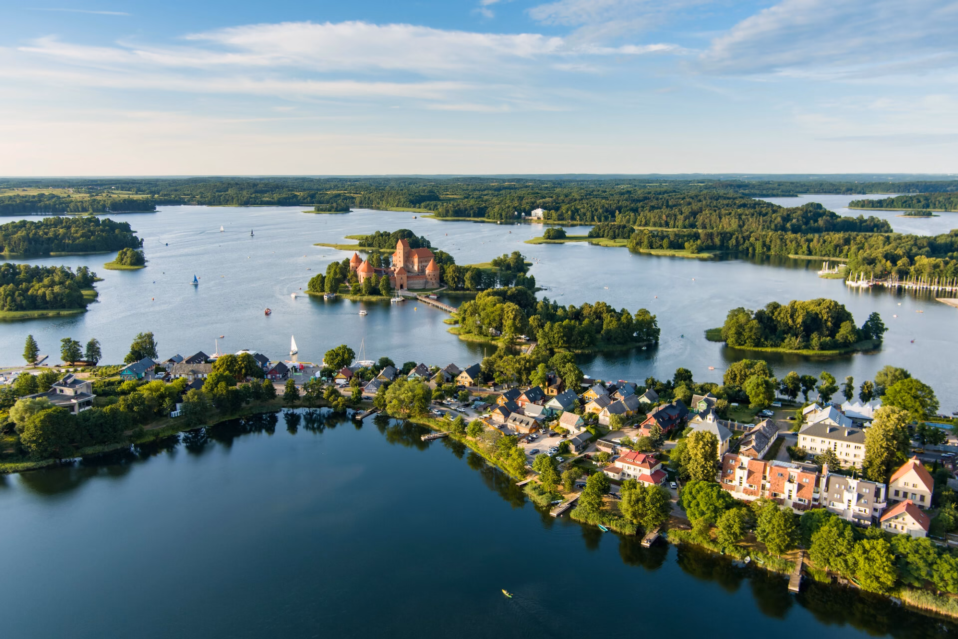 Aerial view of Trakai with lakes, the island castle and houses along the shore