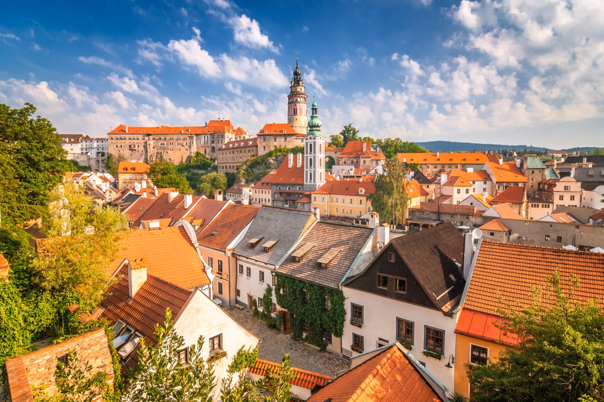 Castle tower in Cesky Krumlov Castle tower in Cesky Krumlov above the red rooftops of the old town