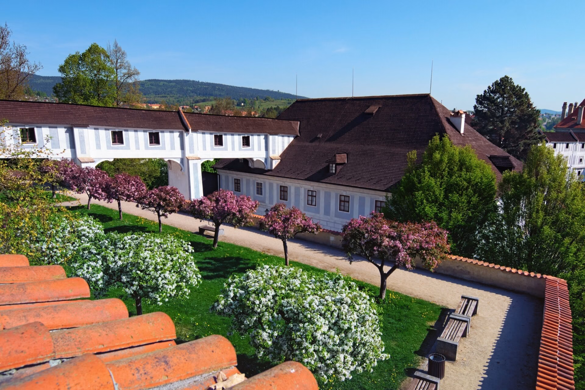 The Summer Riding Hall Summer riding hall in the castle garden of Cesky Krumlov with blossoming trees