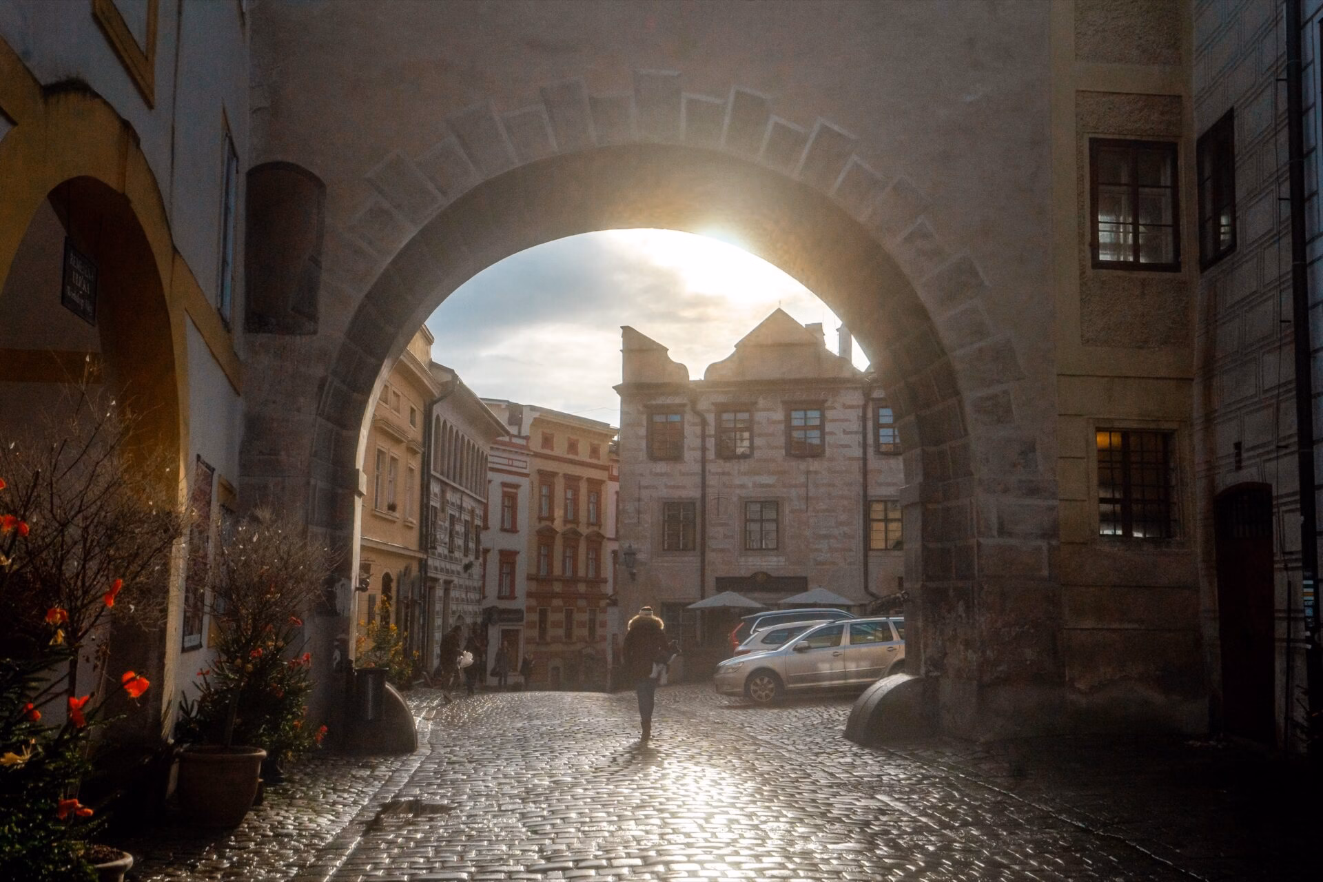 Passage through a gate on Latran street in Cesky Krumlov, backlit