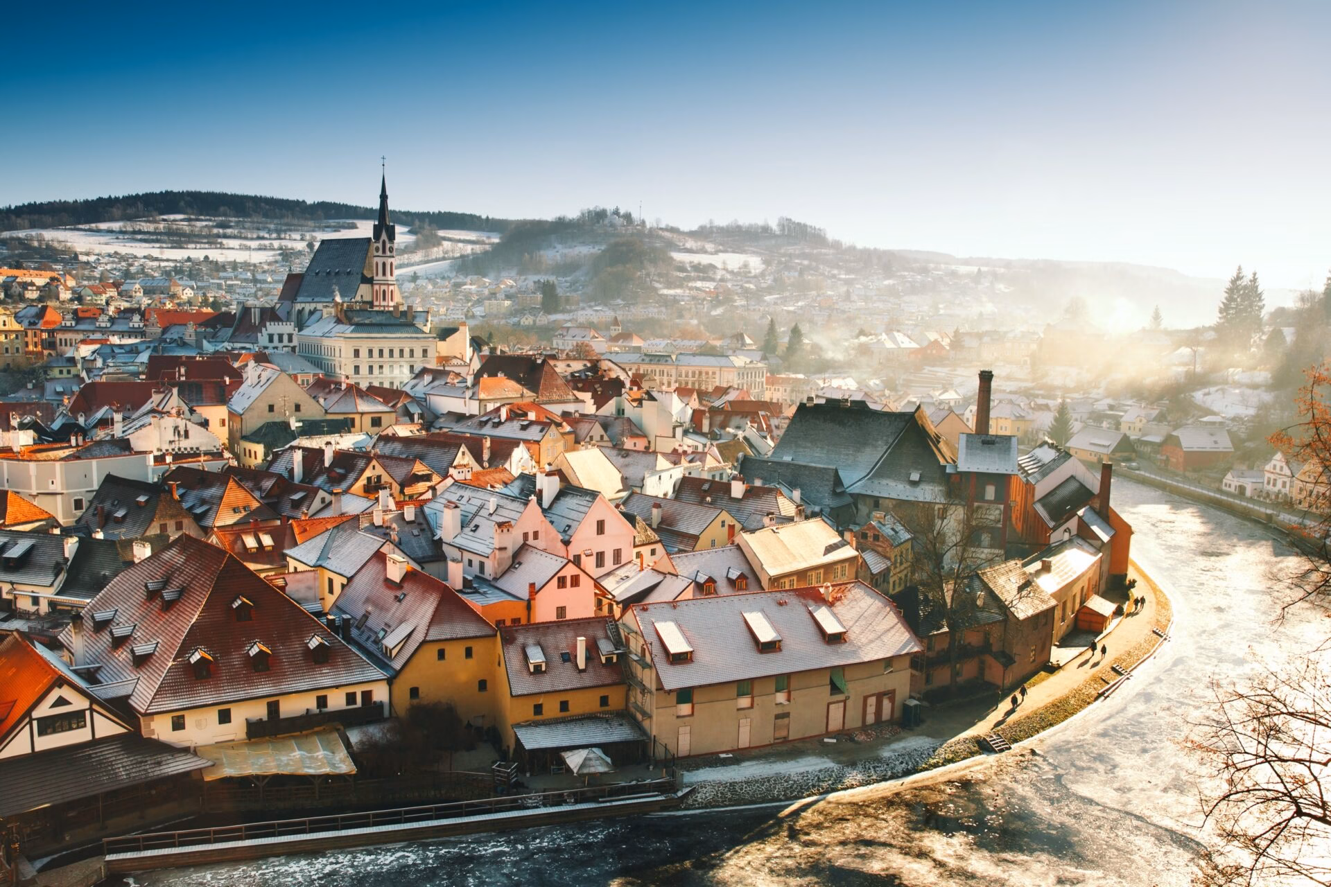 Snow-covered Cesky Krumlov at sunrise during Advent