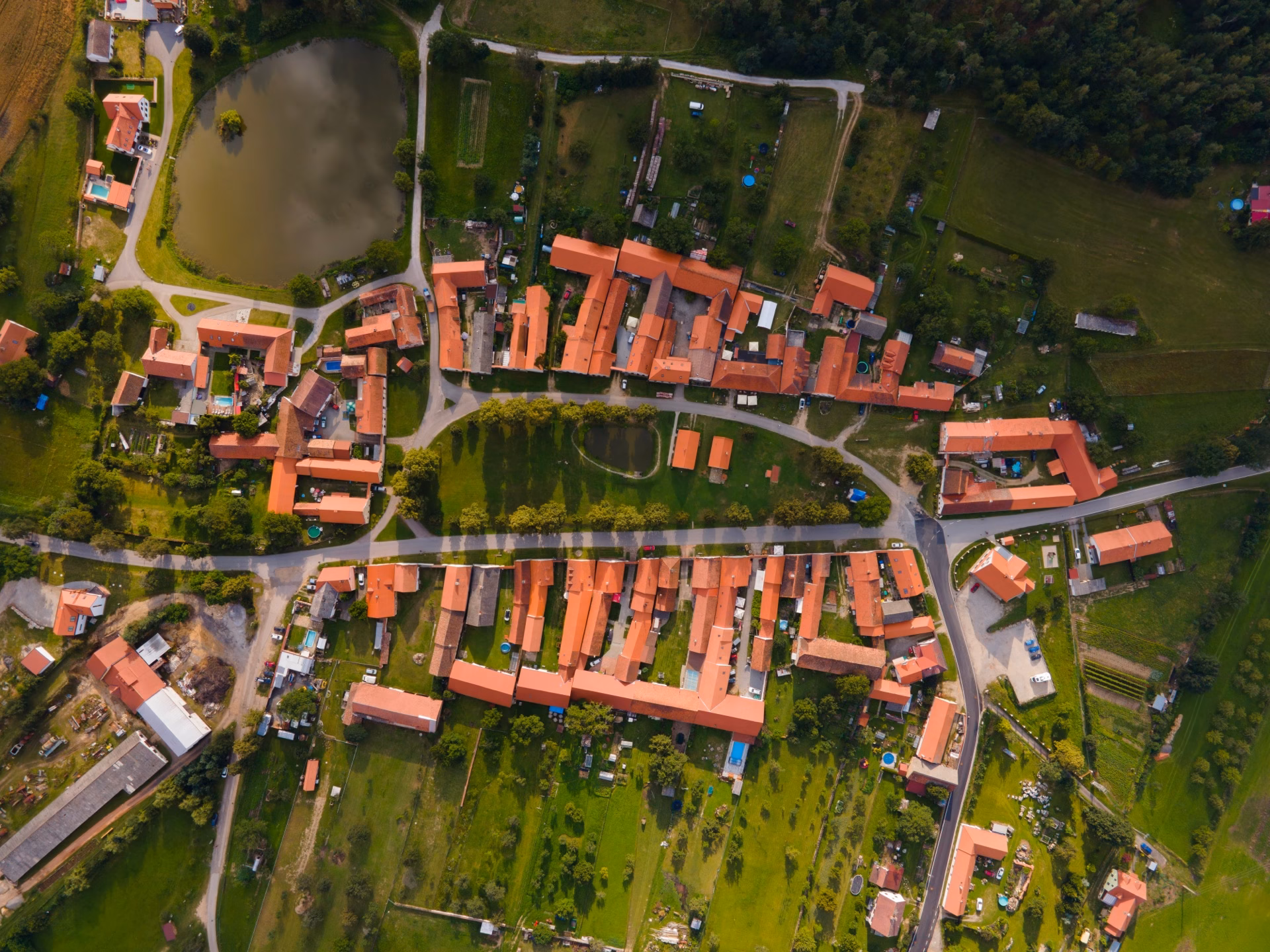 Aerial view of the UNESCO village of Holašovice with its rectangular green and two rows of farmsteads