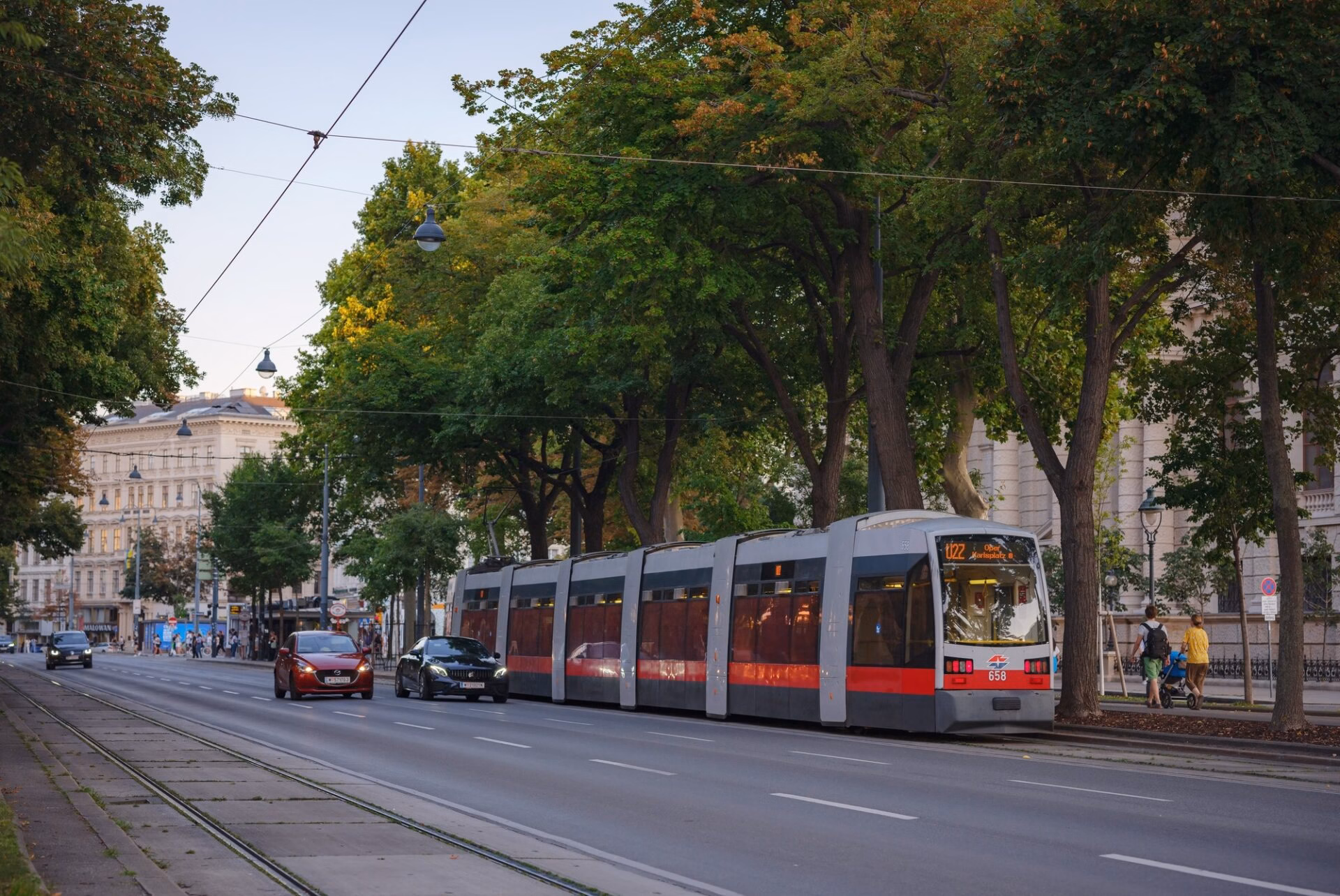 Vienna tram passing along a tree-lined street