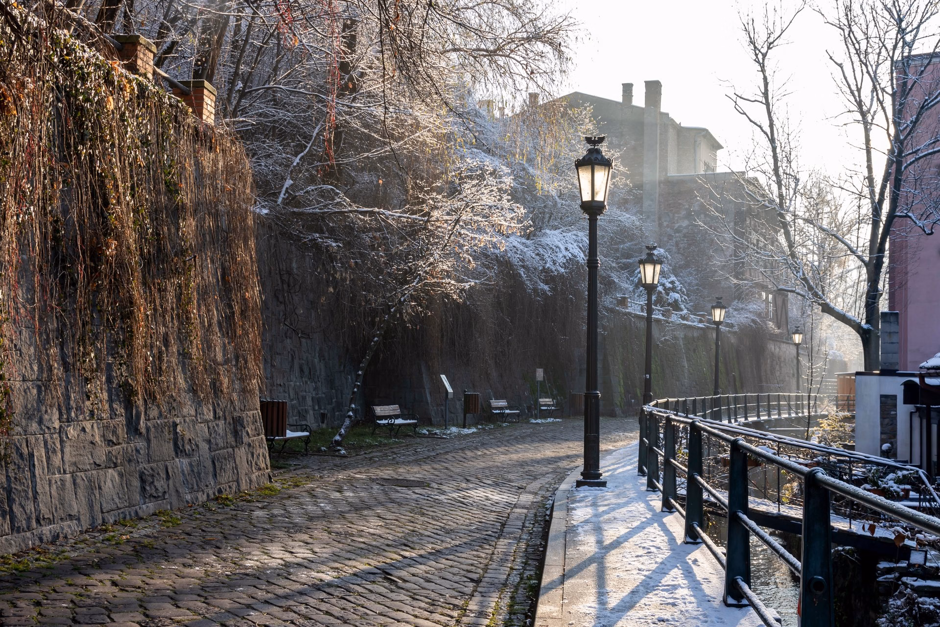 Snow-covered Przykopa Street along the Młynówka canal in Cieszyn Venice