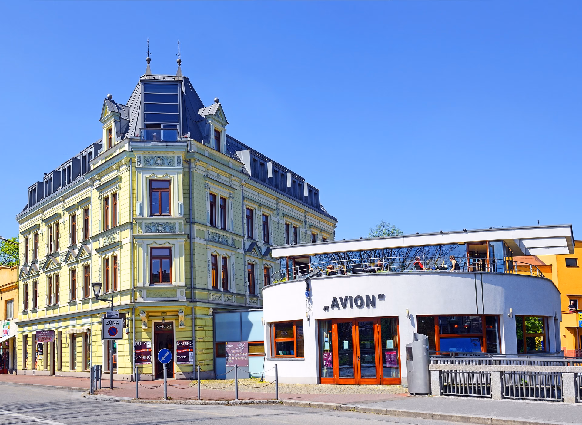 The Avion Café and Reading Room in Český Těšín, a white functionalist building with a rounded façade by the bridge over the Olza